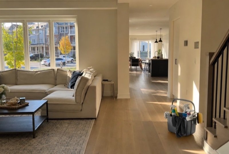 Spotless open-plan living room staged and lit for a showing